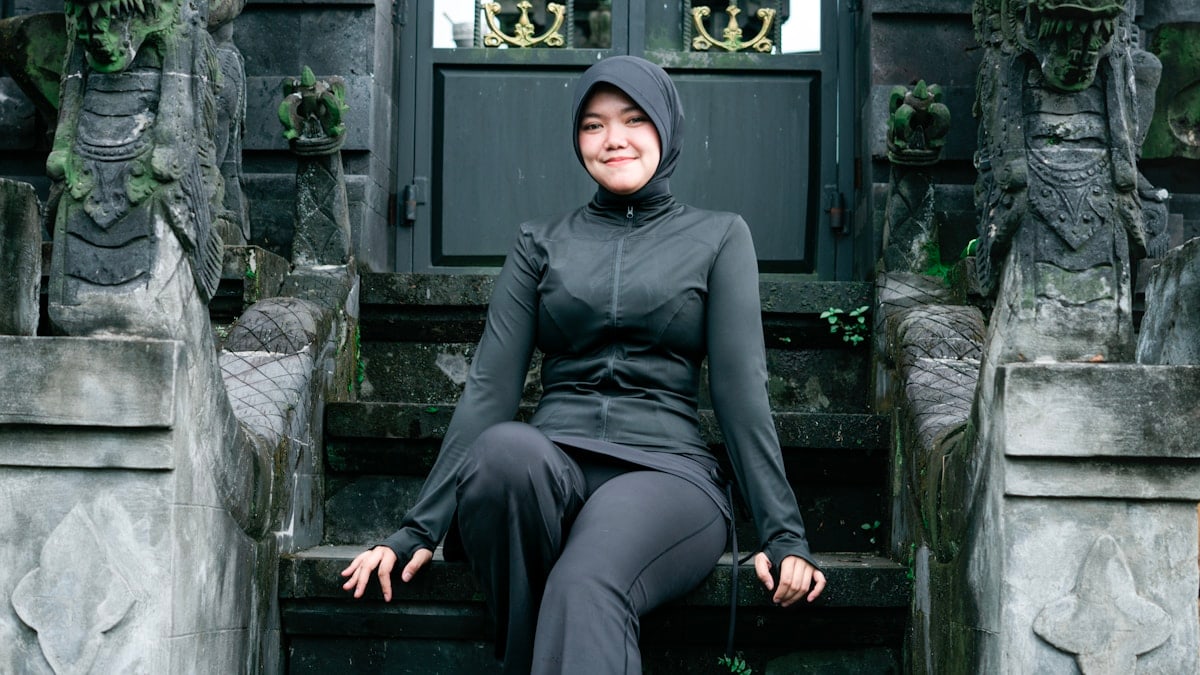 Portrait of Muslim Woman at Traditional Temple Entrance